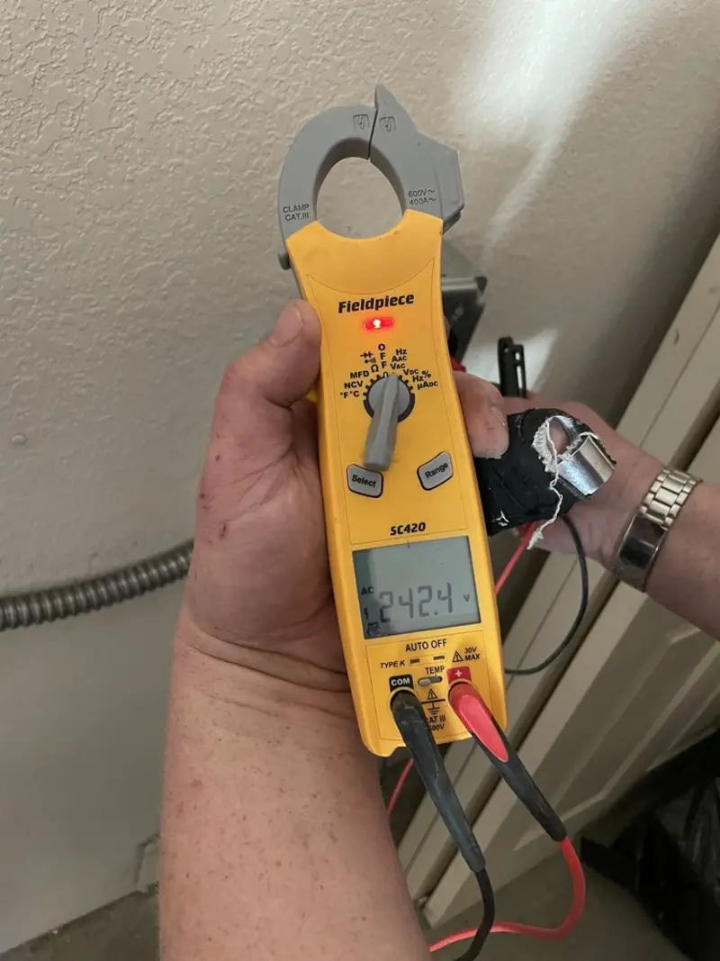 Voltage testing with clamp meter during Outlet Installation in Frankenmuth